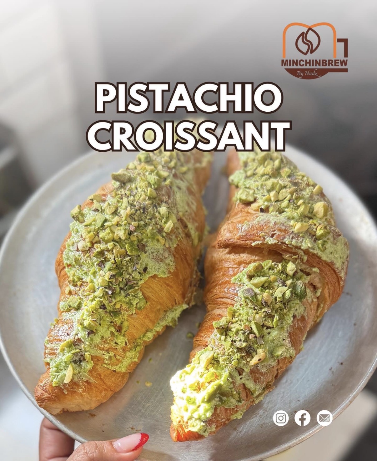 Flaky pistachio croissants dusted with crushed pistachios